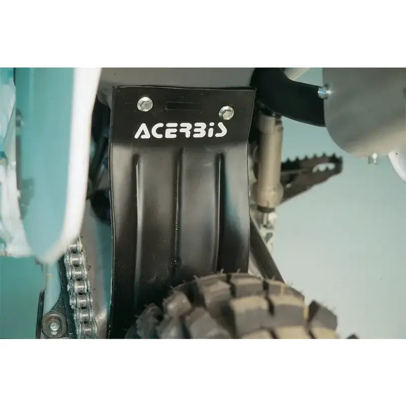 Airbox Mud Flap Black by Acerbis mounted on an off-road motorcycle, protecting the rear shock from mud and debris.