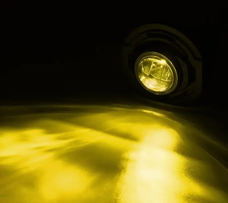 Driving/ Fog Light LED Bulb; LUXX Chip; Round; 12.2 Watt/ 12 Volt; Projector Beam; 720 Lumen For White/ 1200 Raw Lumen; Clear Polycarbonate Lens; Alpha-Black Polypropylene Housing; 6500 Degree Kelvin White Color Temperature; DOT/SAE Certified - NTP