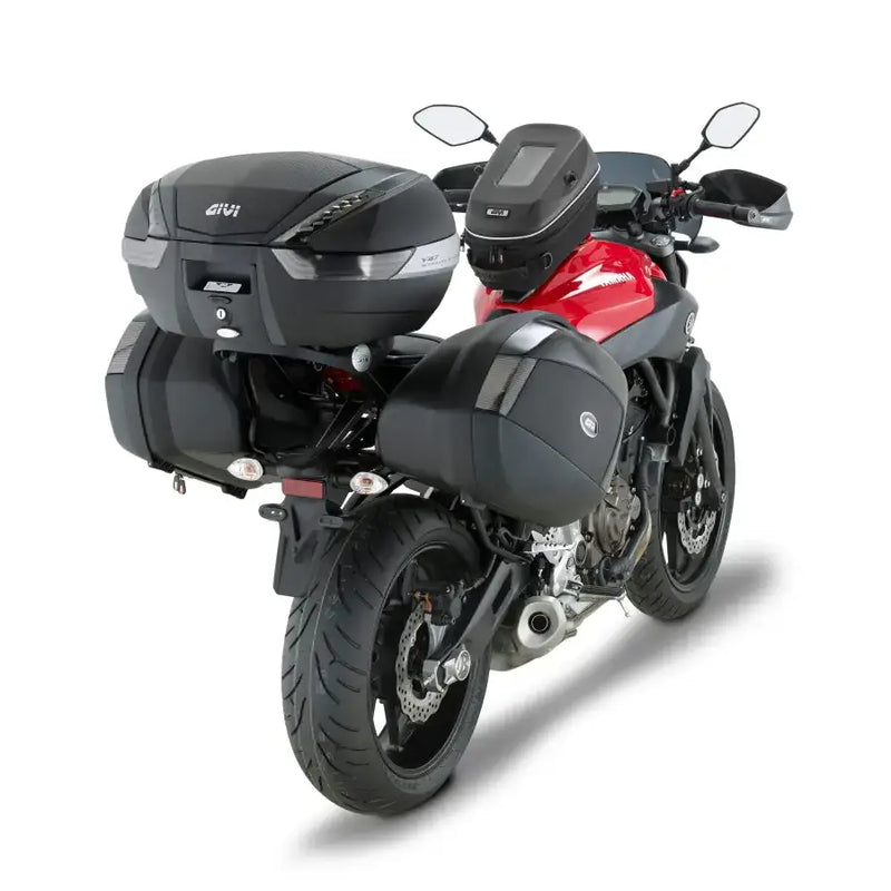 Red and black motorcycle with matte black hard luggage mounting hardware and touring gear