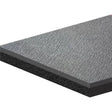 Textured gray and black layered material of Dyna Deck by Dynamat Dyna for soundproofing