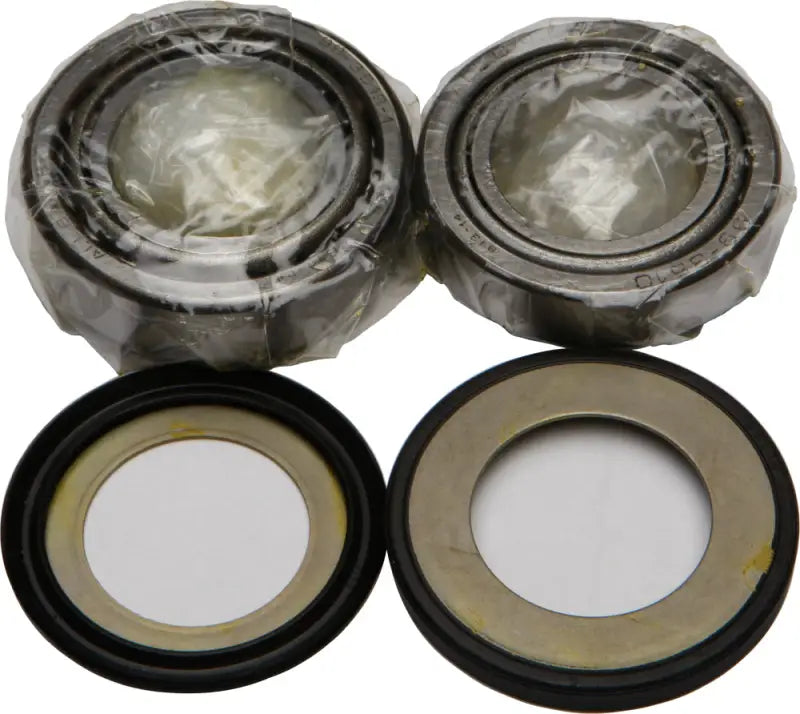 Four automotive steering bearings in the 22-1030 Bearing Seal Kit for steering bearing seal