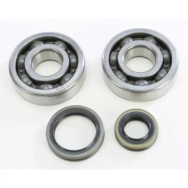 Two ball bearings and oil seals from the 23.CBS32099 Crankshaft Bearing & Seal Kit Suz, perfect RV parts & accessories