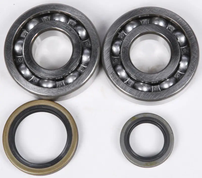 Two ball bearings and oil seals from the 23.CBS33000 Crankshaft Bearing Seal Kit Suz RV parts & accessories