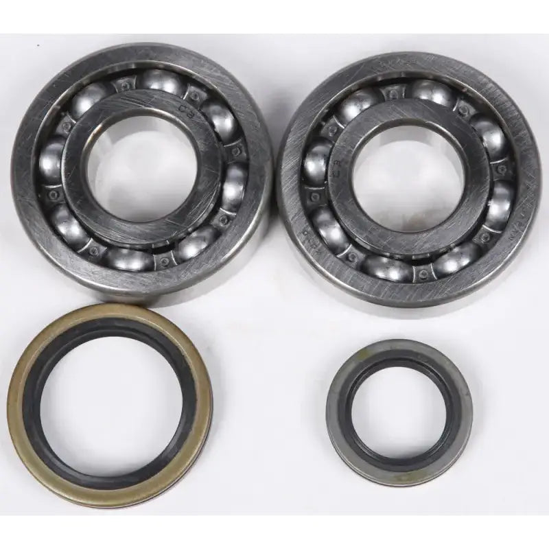 Two ball bearings and oil seals from the 23.CBS33000 Crankshaft Bearing Seal Kit Suz RV parts & accessories