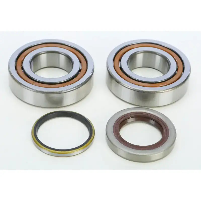 Two tapered roller bearings and oil seals from the 23.CBS63006 seal kit for KTM crankshaft replacement