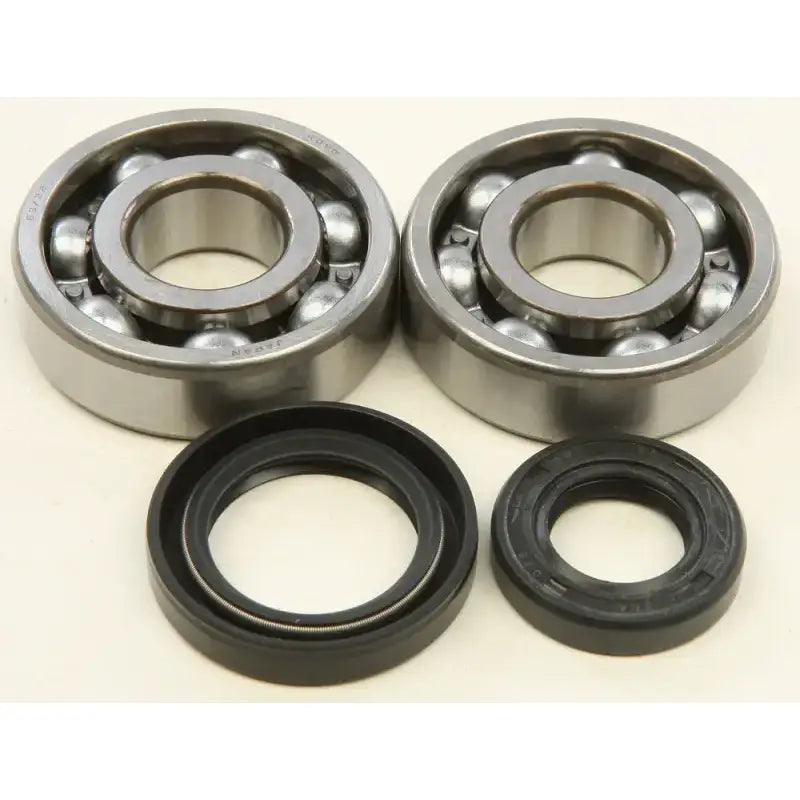 Two deep-groove ball bearings and oil seals from the 24-1075 Crankshaft Bearing Seal Kit, perfect RV parts & accessories