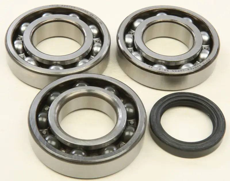 Three ball bearings and oil seal from the 24-1089 Crankshaft Bearing Kit