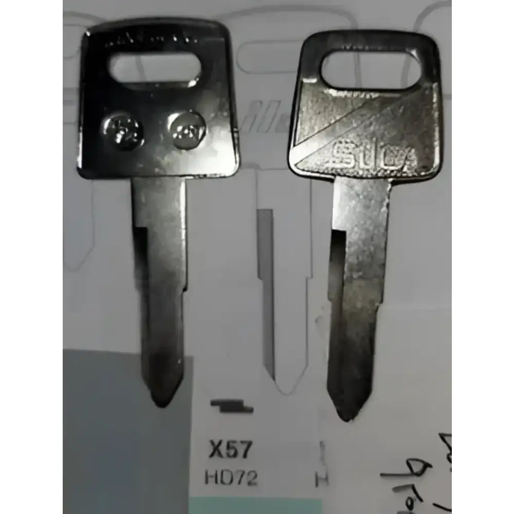 Two metal automotive keys on a Strong Aluminum Construction Enduro Engineering Skid Plate