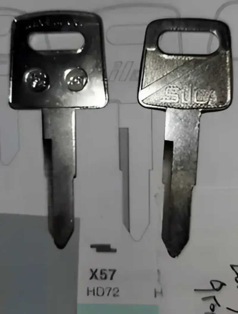 Two metal automotive keys on a Strong Aluminum Construction Enduro Engineering Skid Plate
