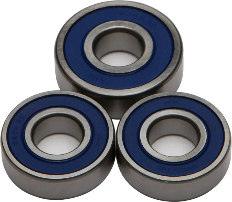 Three blue-sealed ball bearings from the 25-1242 Rear Wheel Bearing/Seal Kit