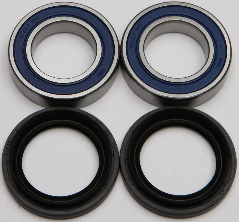 Wheel bearing seal kit with two blue-sealed ball bearings and black rubber seals