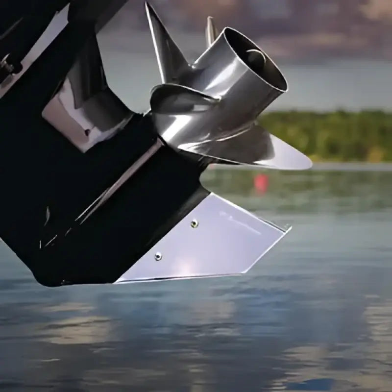 27341 Keelguard Skegguard protecting a Mariner outboard motor's skeg in a serene lake, ensuring durability against rocks and underwater hazards, Marine, AVADA - Best Sellers, Must Haves