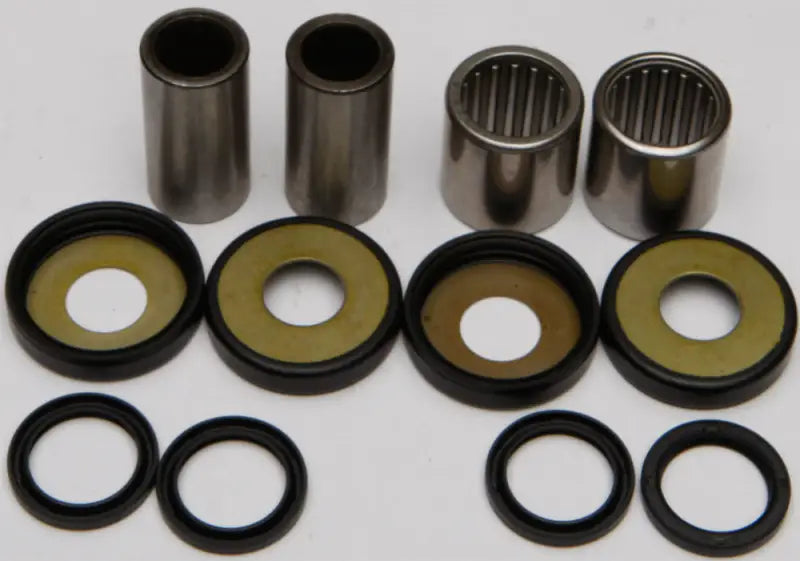 Swingarm bearing kit with metal bushings, bearings, and rubber seals for assembly