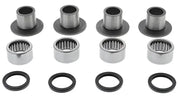 Four sets of metal bearings bushings and seals in a Swingarm Bearing Kit for easy repair