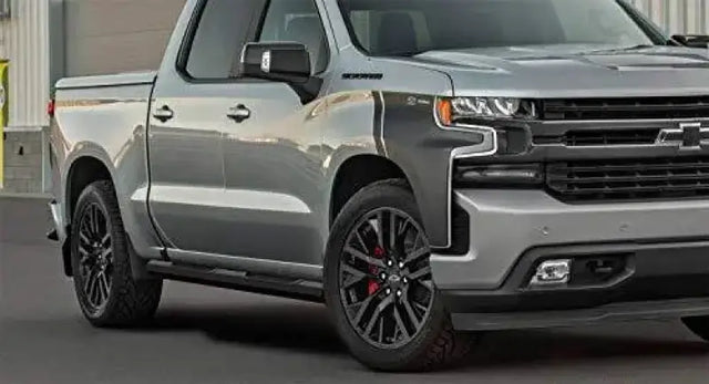 Silver Chevrolet pickup truck with Maxway Octa Series step bar for easy access