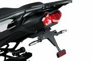 Rear view of black motorcycle fender eliminator kit with red taillight and signals