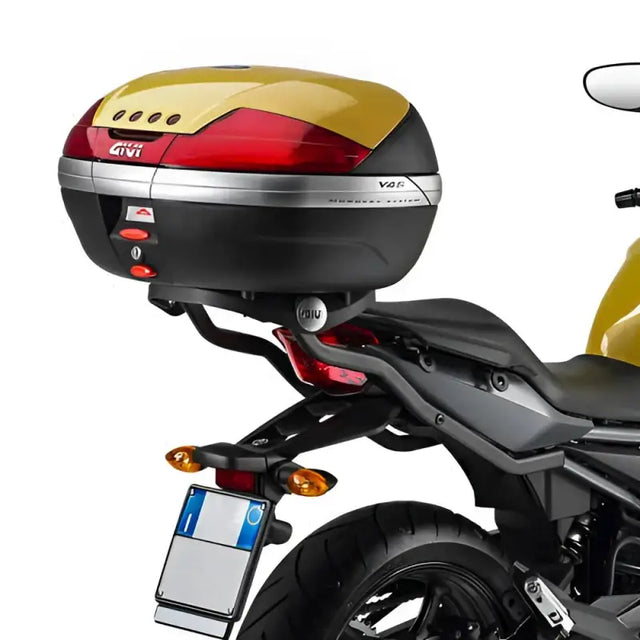Motorcycle top case with red gold accents, matte black hard luggage mounting hardware