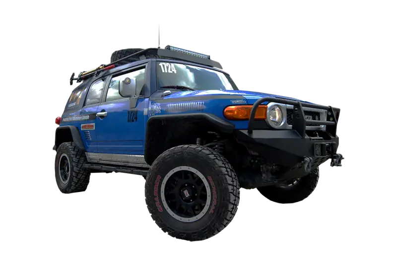 Blue off-road Toyota FJ Cruiser on Warrior Prod Rack for ultimate adventure look