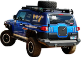 Blue off-road vehicle with roof rack on Warrior Prod Rack for tough adventures