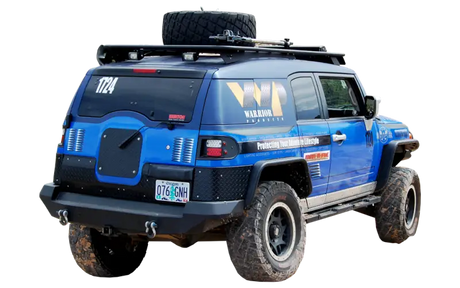 Blue off-road vehicle on Warrior Prod Rack for durable off-road gear storage