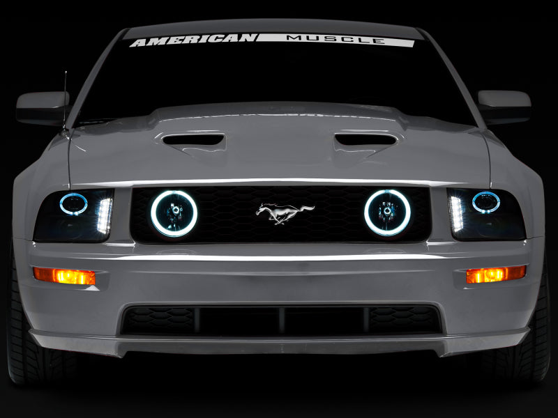 Raxiom 49128 Raxiom 05-09 Ford Mustang w/ Halogen LED Halo Prjctr Headlights-Blk Hsng(Smoked Lens Exclude GT500)