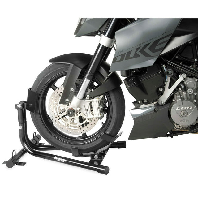 BikeMaster Universal Steel Roll-On Stand supporting a motorcycle front wheel for maintenance and storage.