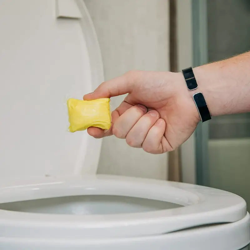 Yellow toilet bowl cleaner tablet from 41472 Camco Wild Thing #2 On The Charts Drop-I