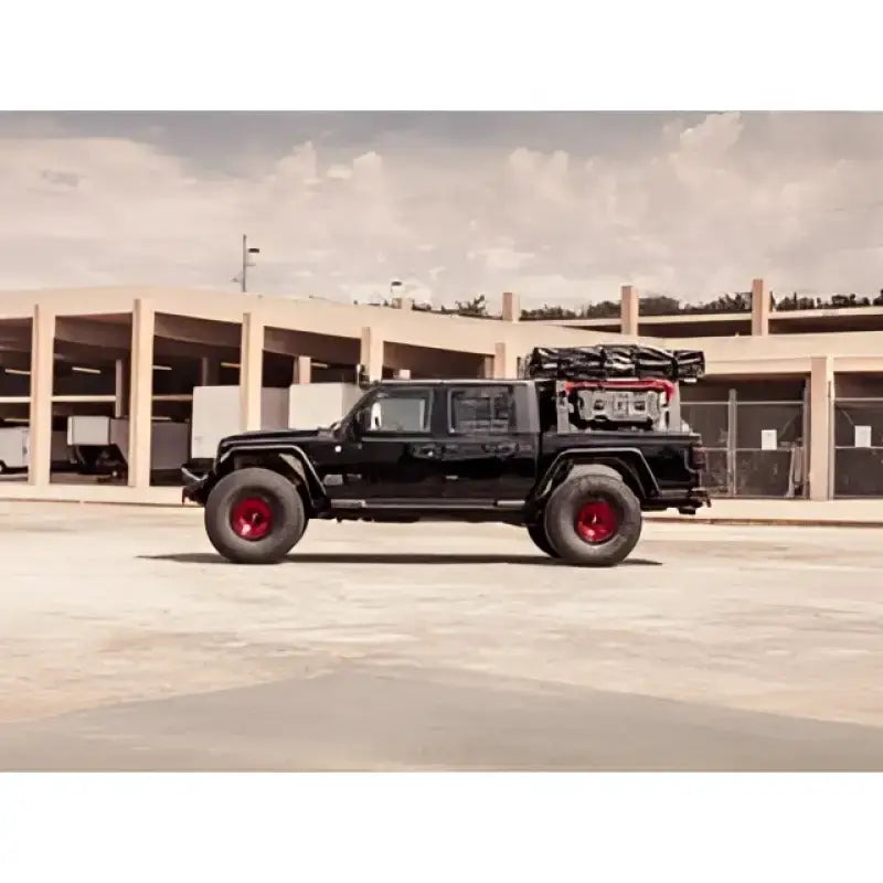 Black 2021 Jeep Gladiator with red wheels in 4191XFSPB Road Armor Spartan