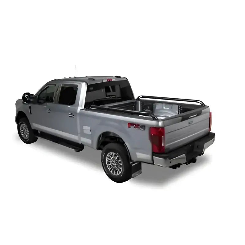 Silver pickup truck with Putco Black Nylon Boss Locker Side Rails for added style