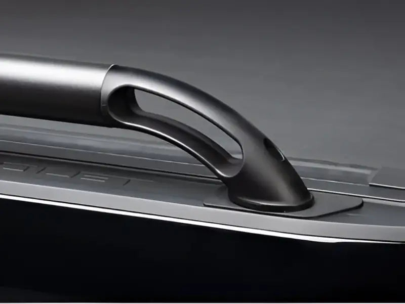 Curved black nylon Putco handle on Boss Locker side rail