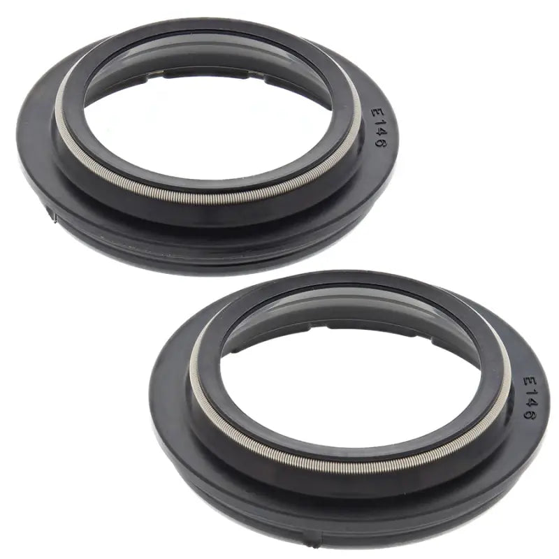 Two black rubber seals from 57-146 Fork Dust Seal Kit for fork dust seal replacement