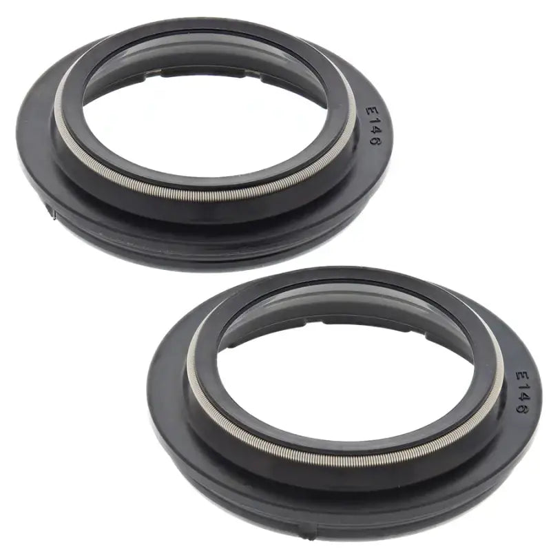 Two black rubber seals from 57-146 Fork Dust Seal Kit for fork dust seal replacement