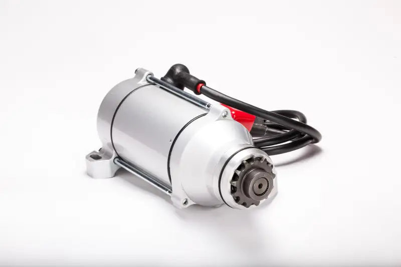Silver starter motor with black cable and red connector for RV and truck parts