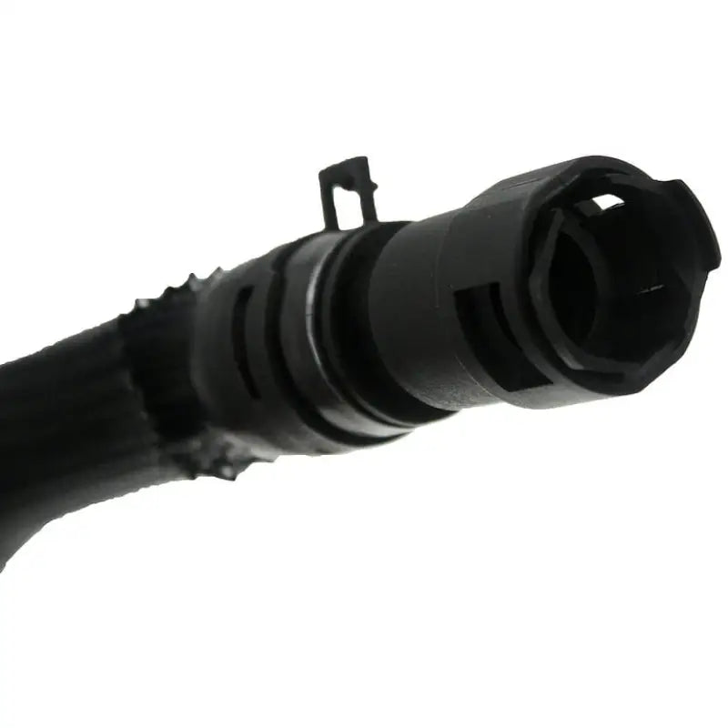 Black plastic hose connector from Dorman engine heater hose assembly for engine heater use