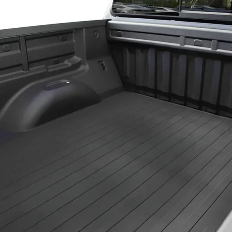 Heavy-duty 639N Trailfx Bedmat installed in a Chevrolet/GMC truck's 5.5' bed, featuring a non-slip surface for superior cargo protection, Truck & Automotive, Truck Bed Accessories, AVADA - Best Sellers.