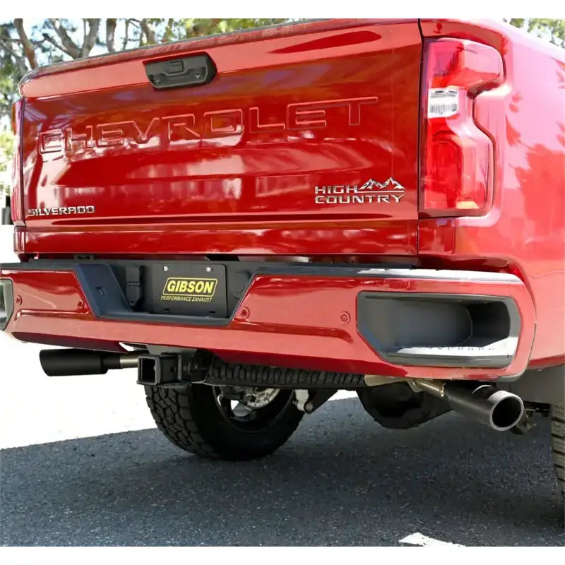 Red pickup truck with Gibson Exhst dual extreme exhaust system for better performance