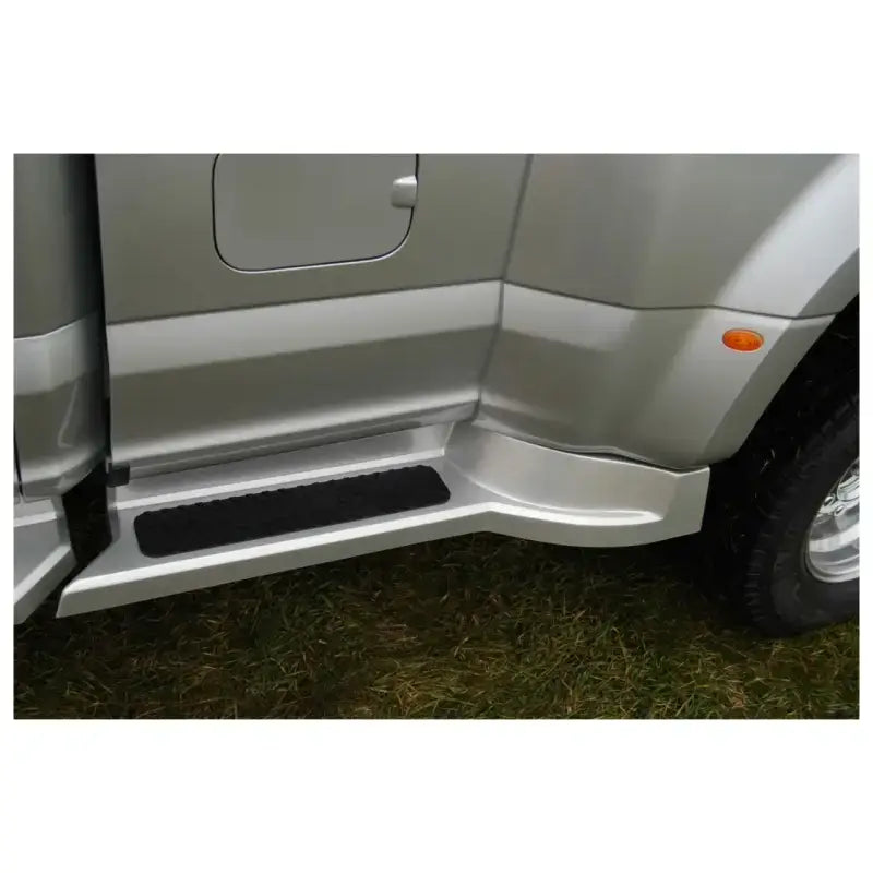 Silver Ford Transit with roof rack and side step for carrying oversized equipment