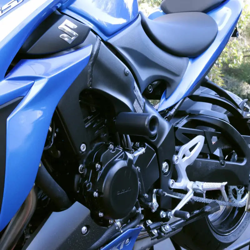 Blue and black Suzuki sport motorcycle with Shogun frame sliders for protection