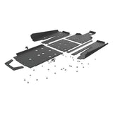 Disassembled black metal Seizmik skid plate kit with fasteners and tree kickers