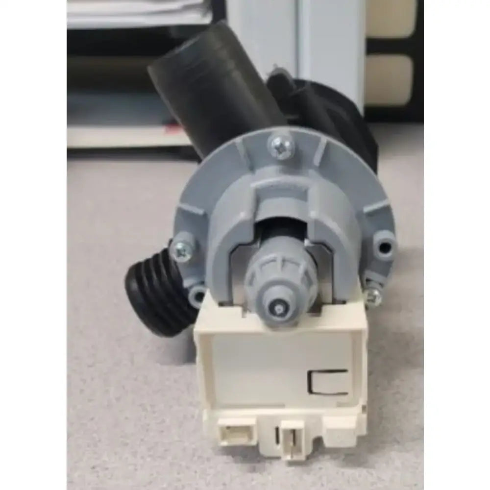 Gray and beige Splendide washer dryer drain pump with black hoses