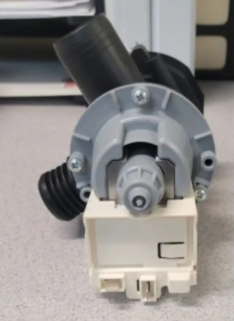 Gray and beige Splendide washer dryer drain pump with black hoses