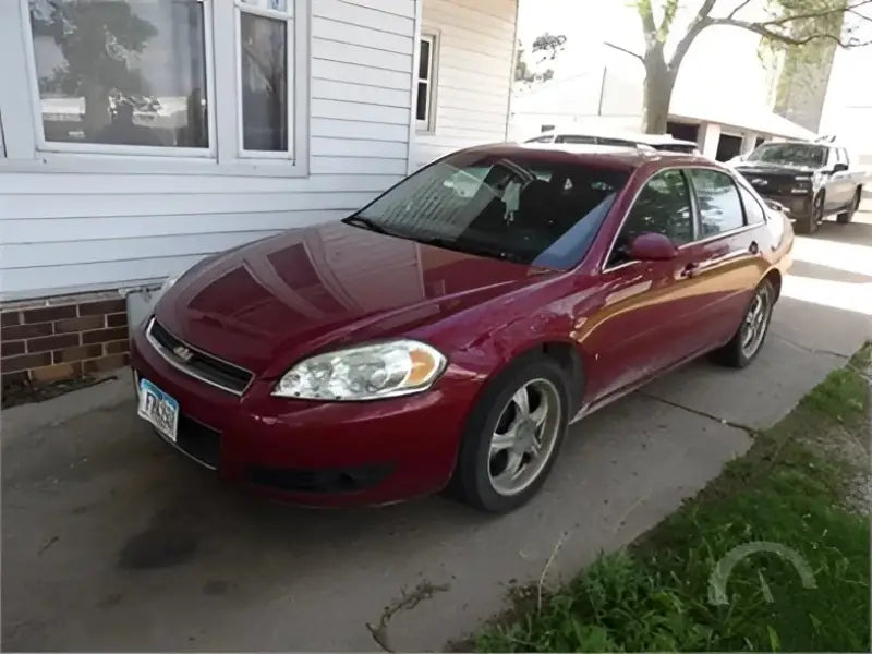 Red Chevrolet Impala sedan with 77-4400-R-T Spike rear windshield tint upgrade
