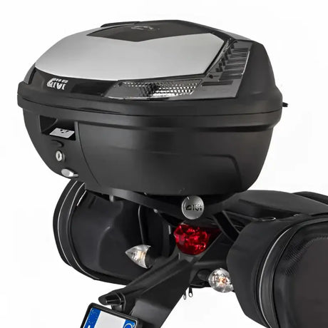 Black matte black motorcycle top case with integrated lights and luggage mounting hardware