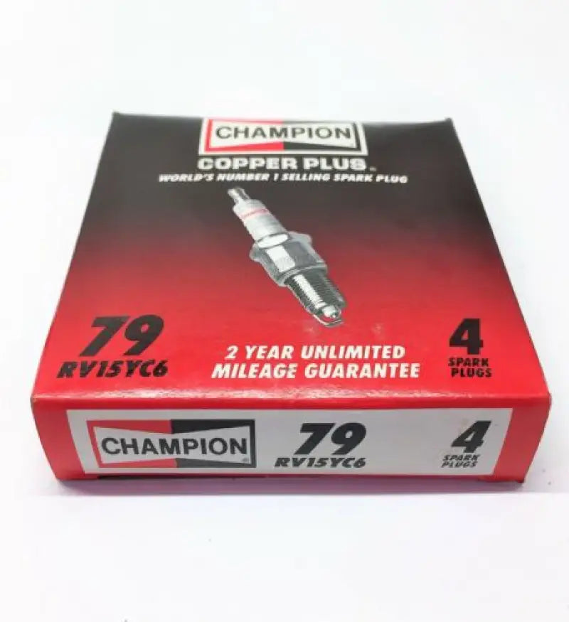 "79 Champion Spark Plug 4/Box packaging showing front view with Champion branding and spark plug image, highlighting 2-year unlimited mileage guarantee"