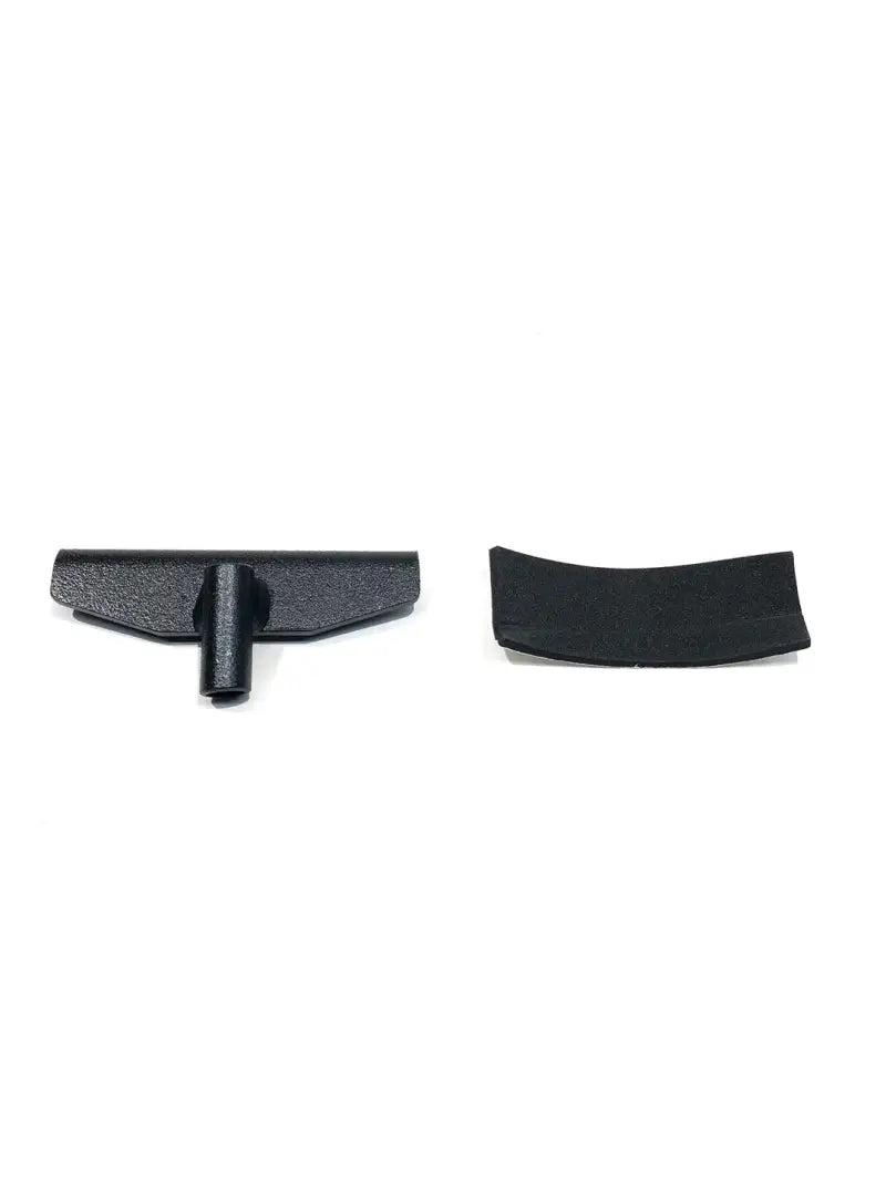 Black plastic T-shaped tool and curved piece for rack cut replacement on exposed rack
