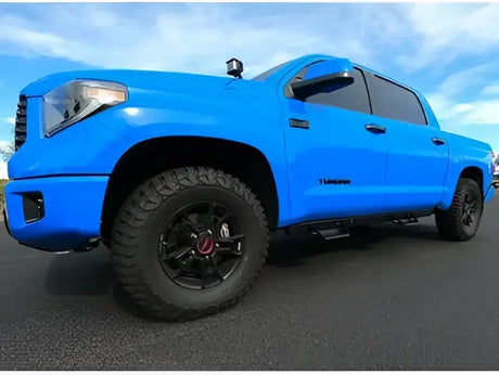 Bright blue Toyota Tundra with ici stainles aluminum side steps for easy access