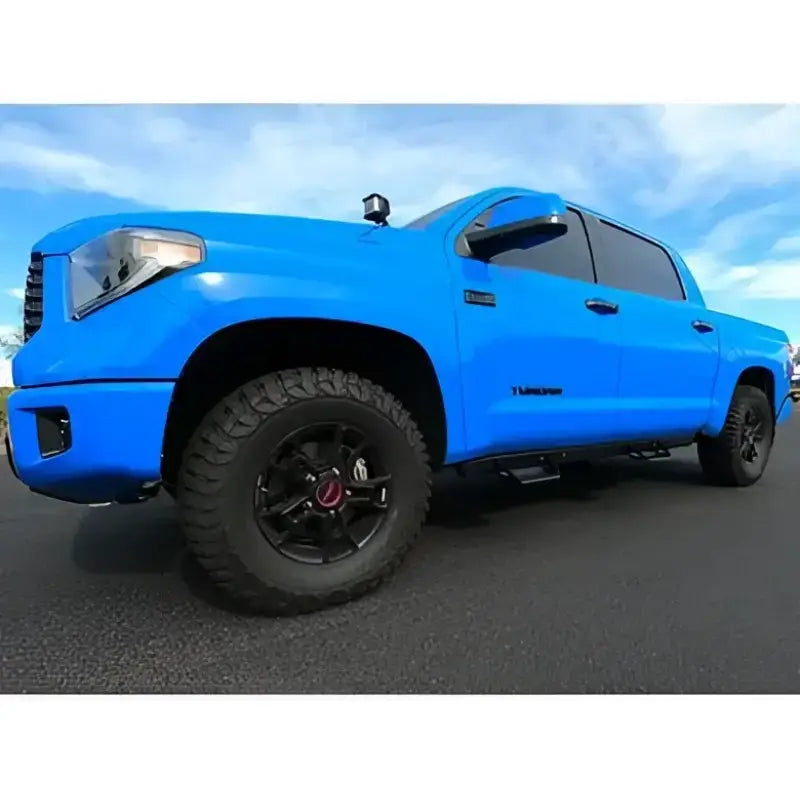 Bright blue Toyota Tundra with ici stainles aluminum side steps for easy access