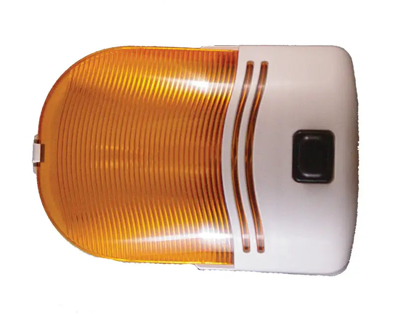 Orange and white light with square black button and grooved plastic cover.