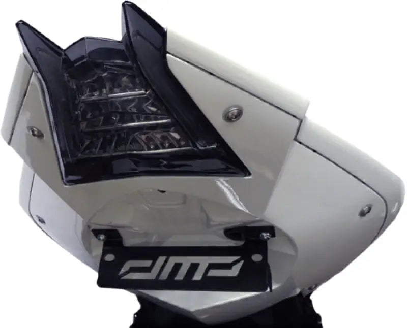 White motorcycle tail fairing with black tail light showcasing DMP Powergrid intense luminescence