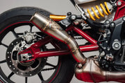 Rear wheel and exhaust of red motorcycle with Sawicki FTR Slip RV parts & accessories